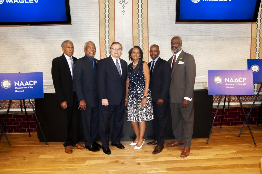 Group photo of Maryland State NAACP leaders and Northeast Maglev CEO Wayne Rogers