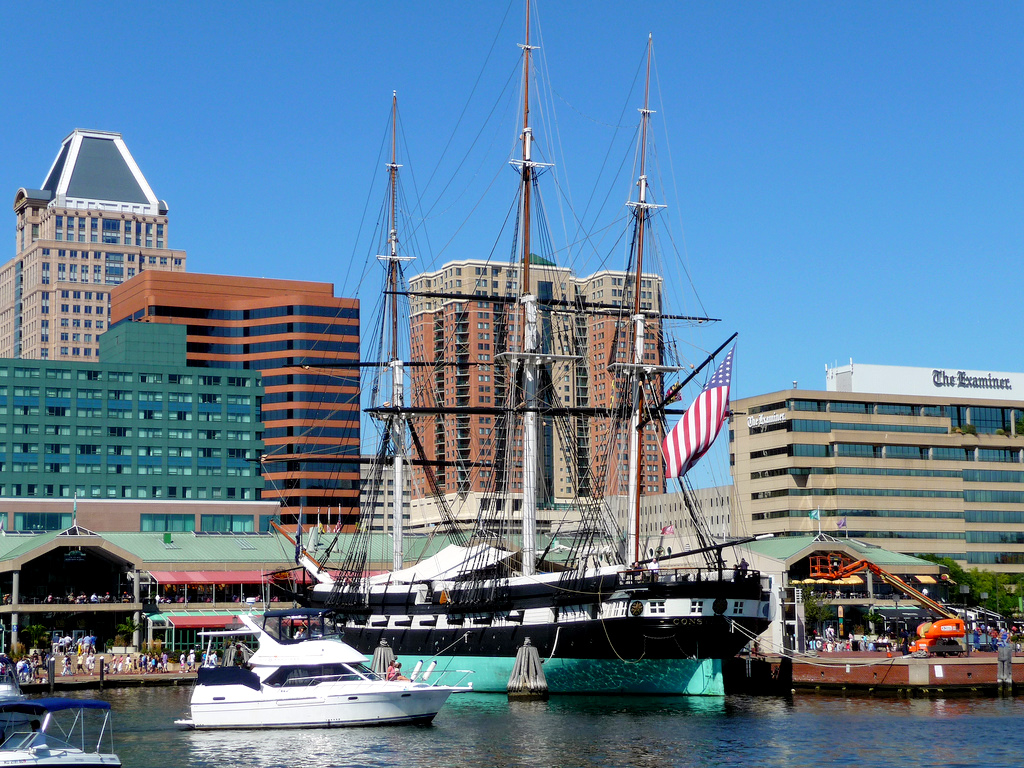 Naval warship USS Constellation at Baltimore's Inner Harbor on a sunny day