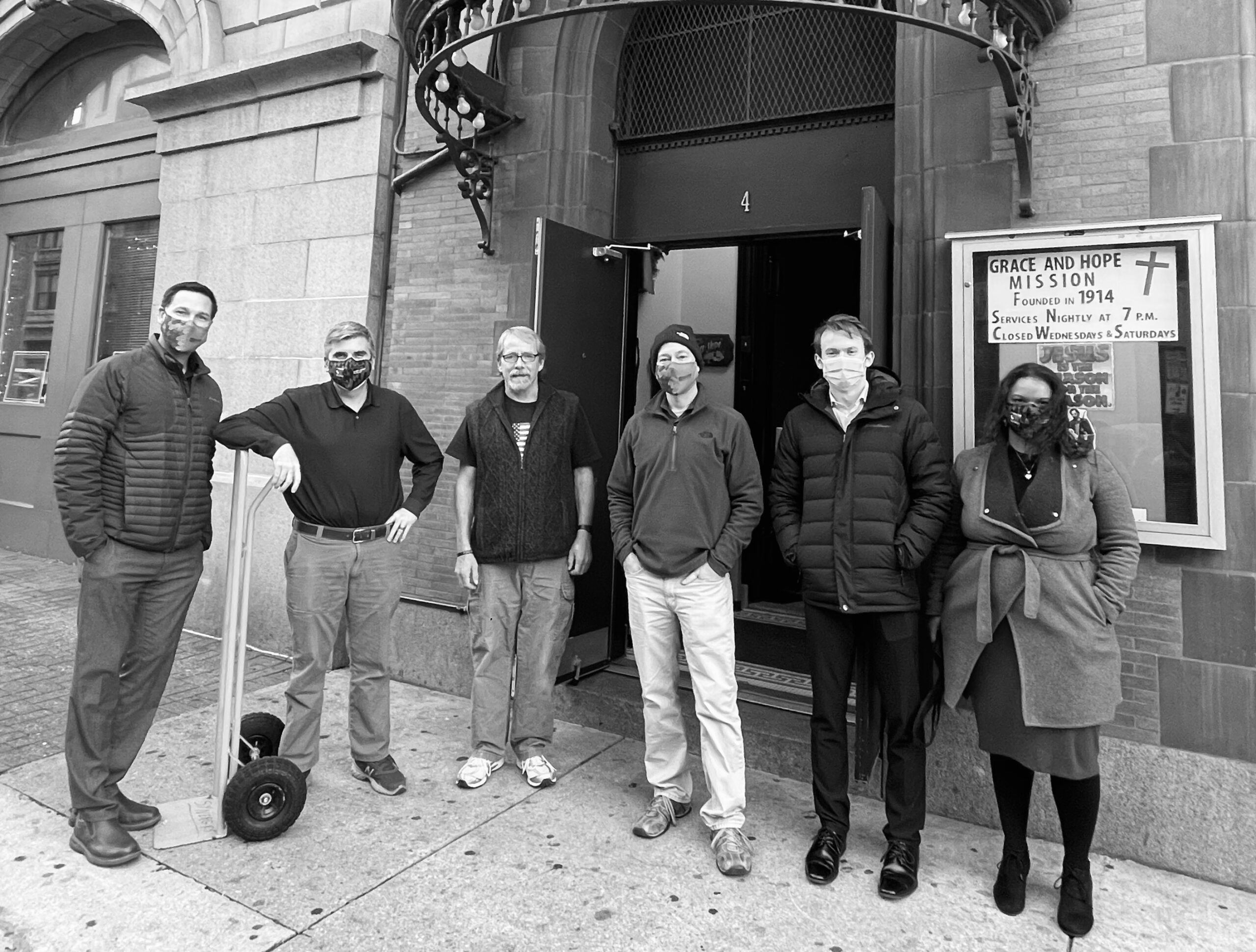 Photograph of Northeast Maglev team members donating to Baltimore's Grace and Hope Mission