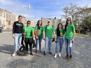 Photograph of Northeast Maglev team members and supporters picking up litter in Baltimore to celebrate Earth Day.