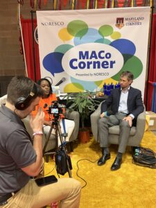 Photograph of Northeast Maglev Senior Vice President Ian Rainey being interviewed at the 2022 MACo Conference