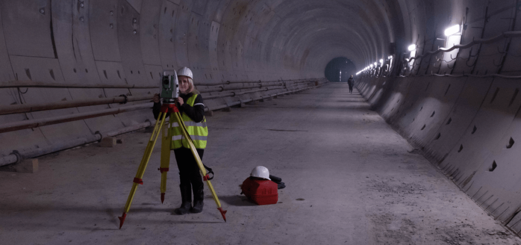 Female worker surveying tunnel