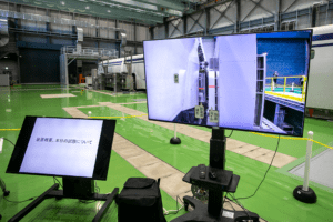 Photograph of computer monitors used on the Central Japan Railway Company Superconducting Maglev vehicle dynamics simulator